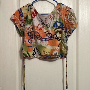 multi-colored shirt from NY Invasion. Size Large. Cropped Shirt.